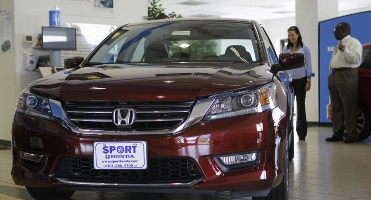 Image: Sales personnel at Sport Honda look over first 2013 Honda Accord to hit showroom floor in Silver Spring, Maryland